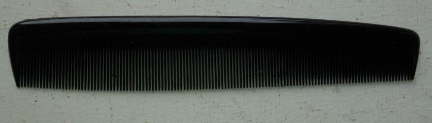 In a mint condition a German Comb/Hairbrush.