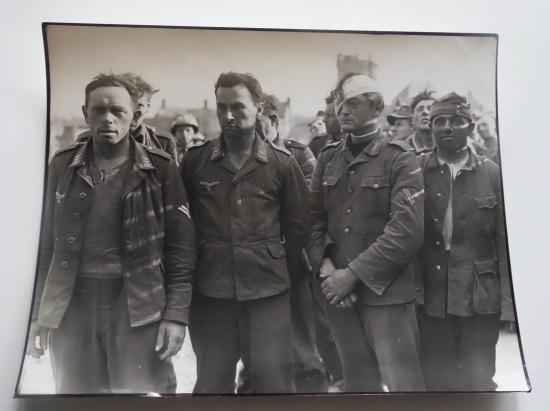 a british ww2 press picture of german prisoners of war