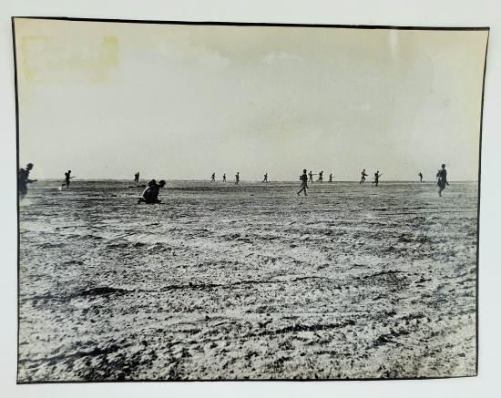 a british ww2 press picture off a group soldiers attacking