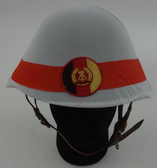 a postwar East German steel  helmet.with cover