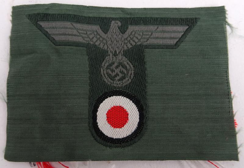 A wehrmacht m42 trapezoid bevo cap insignia