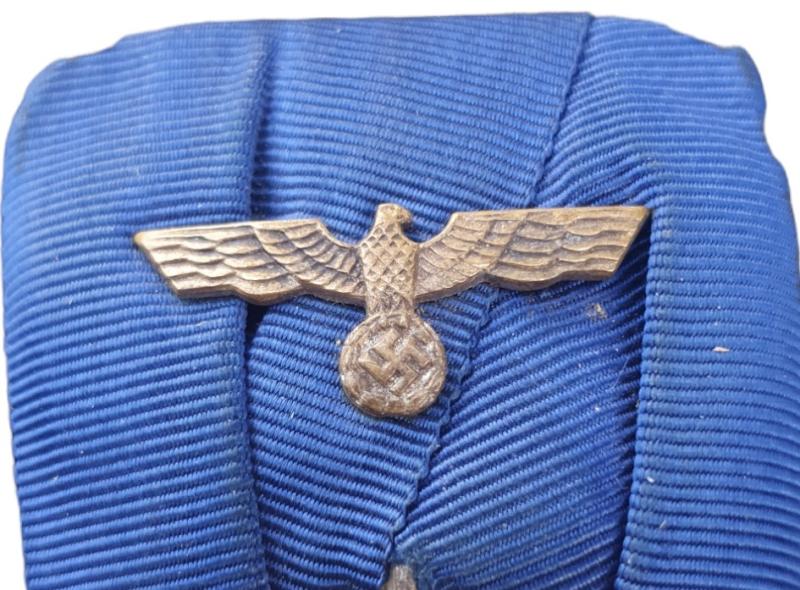 a wehrmacht  4 jears long service award with miniature eagel