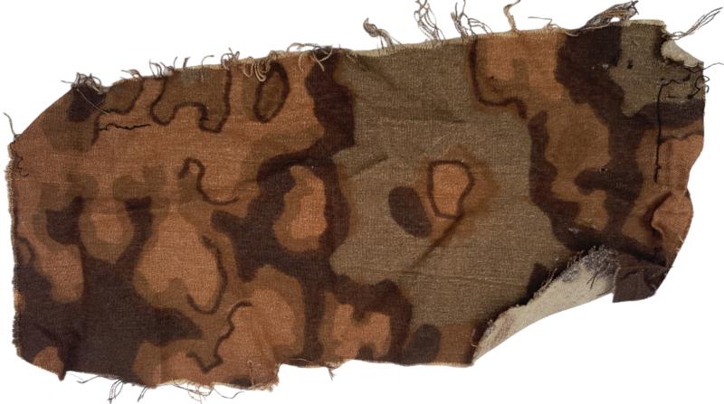 a rare  piece off fabric from the waffen ss in oak