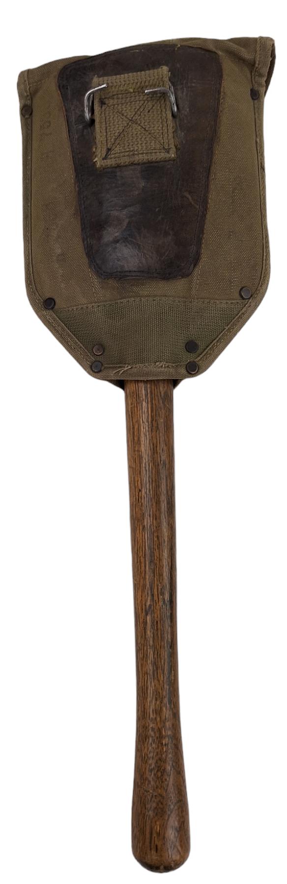 a US ww2 shovel with an original cover