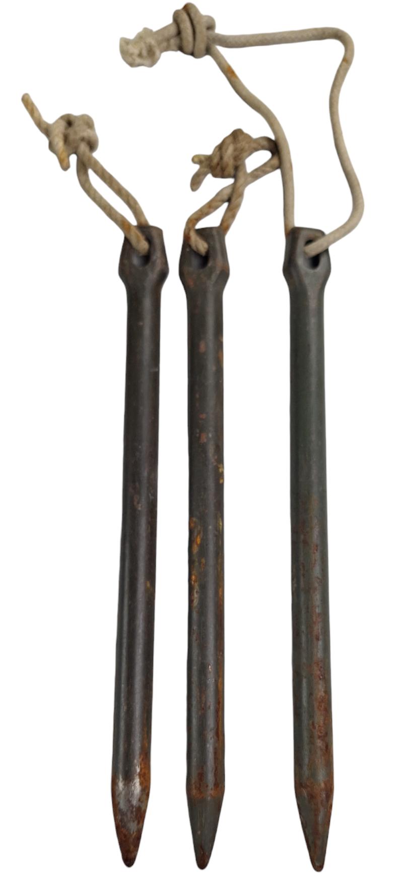 a german ww2 set off  three  tent pegs