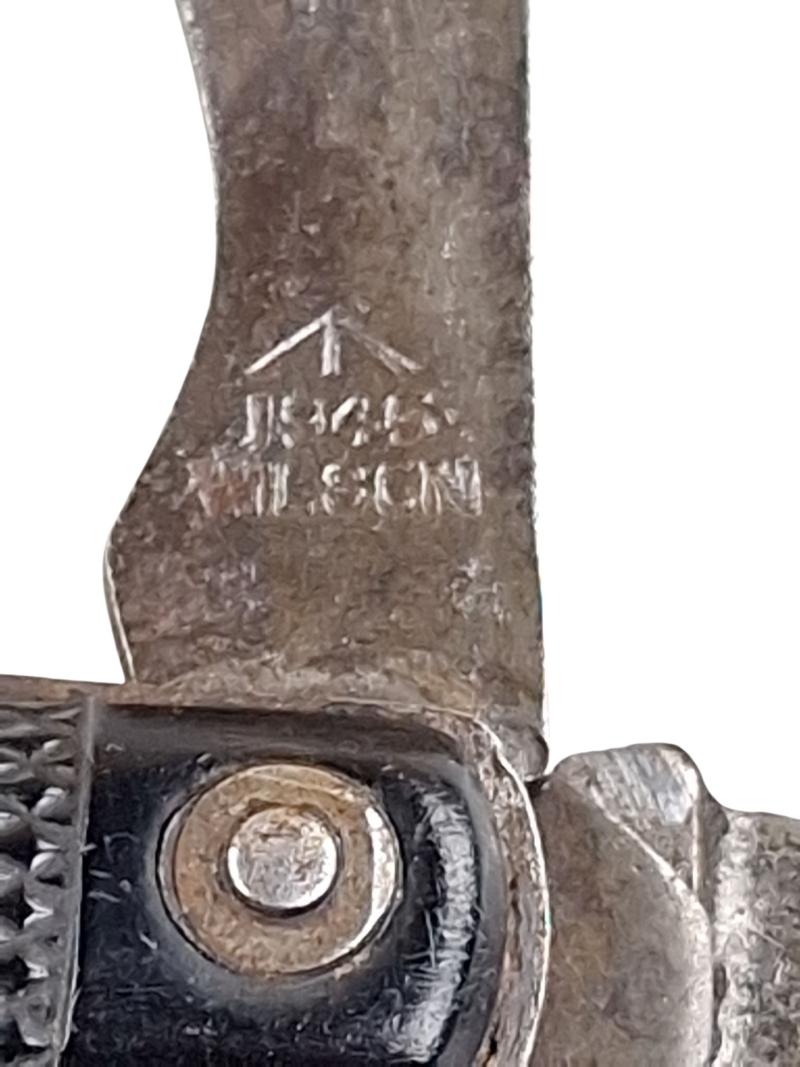 A british ww2 pocket knife with its original string