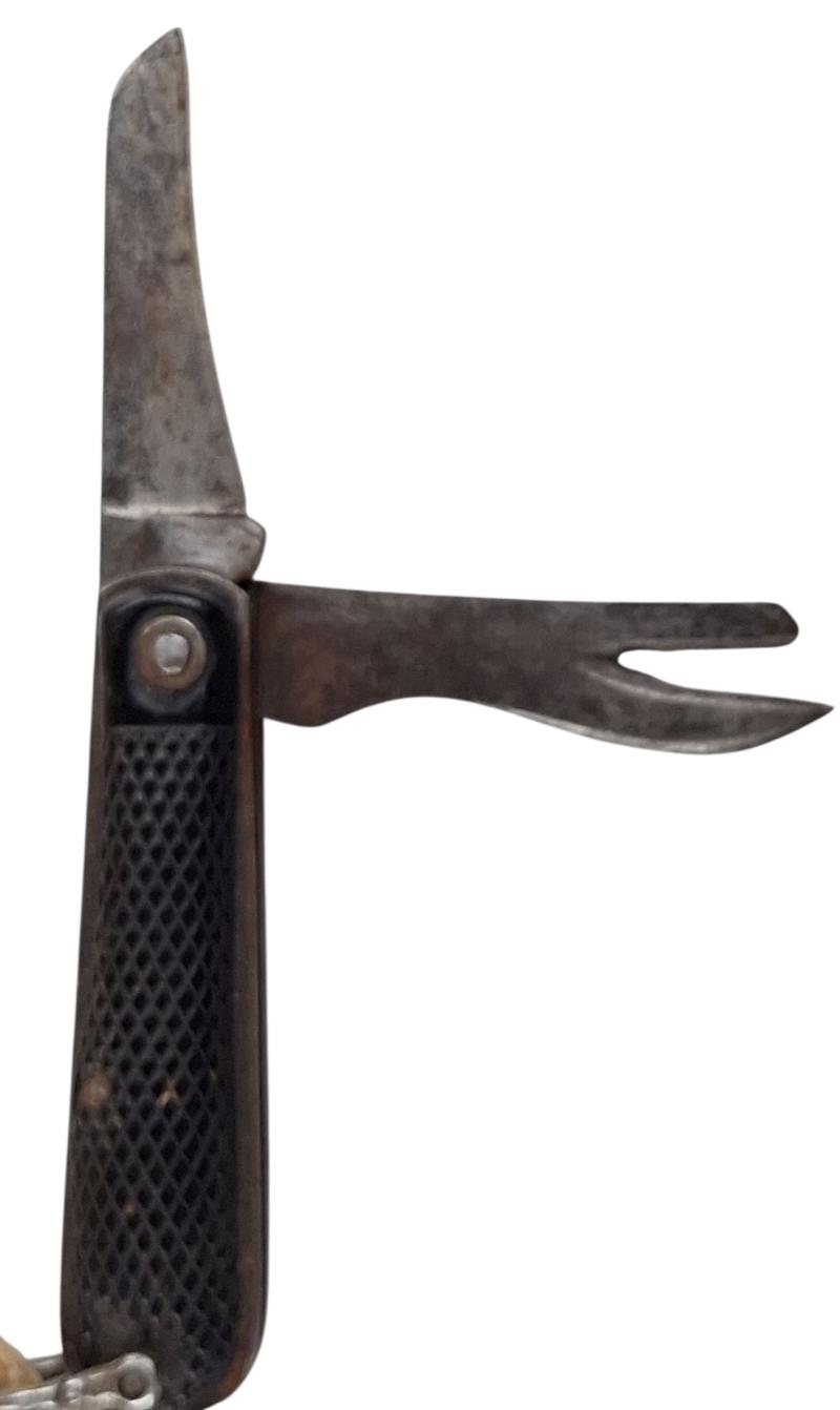 A british ww2 pocket knife with its original string