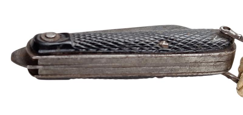 A british ww2 pocket knife with its original string