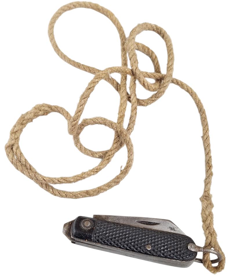 A british ww2 pocket knife with its original string