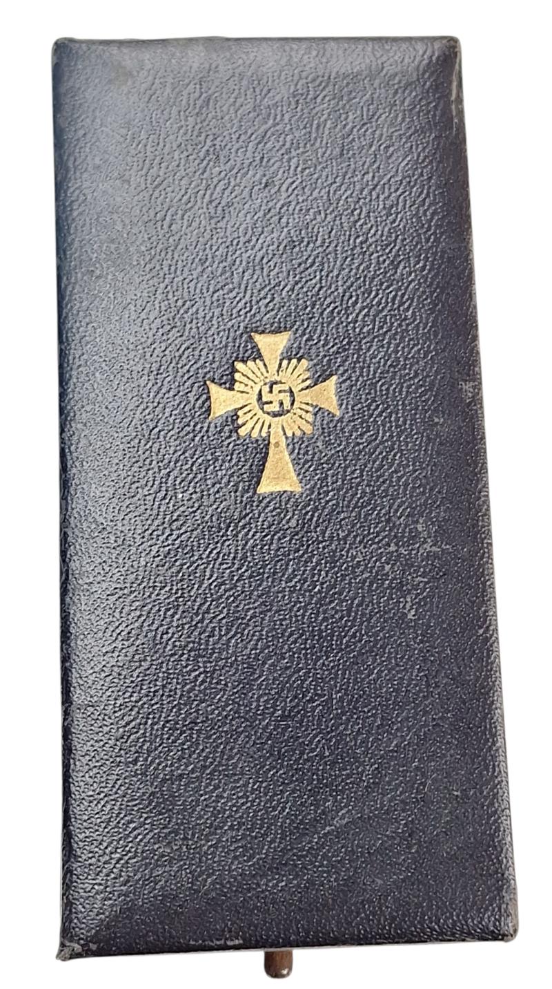 a german ww2 mother cross in gold in its original box