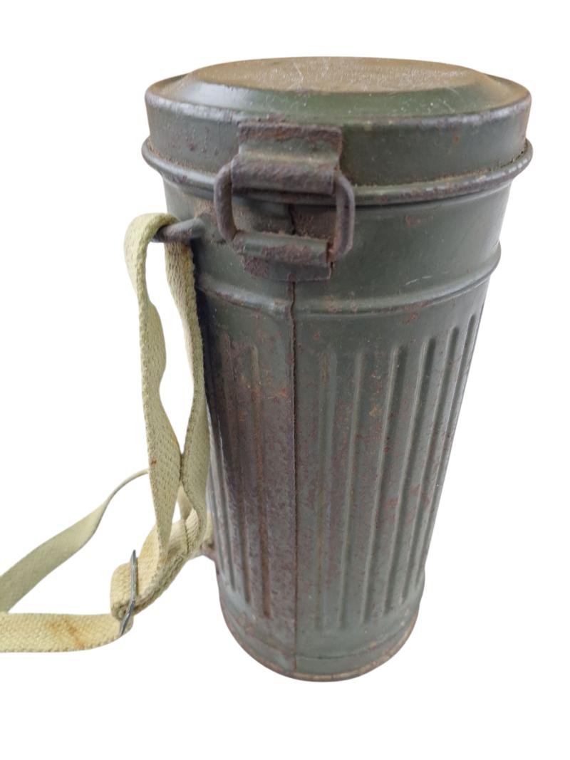 a tall m38 gasmask with original carrying strap
