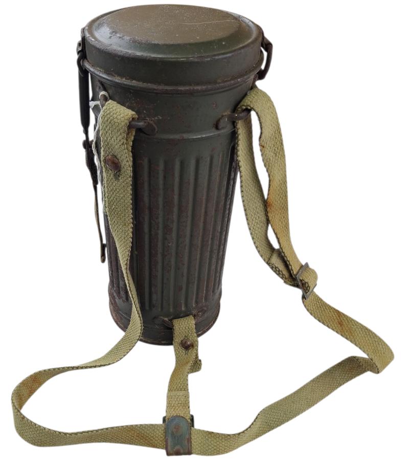 a tall m38 gasmask with original carrying strap