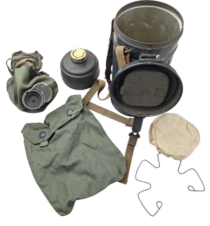 a small m38 gasmask with original carrying strap