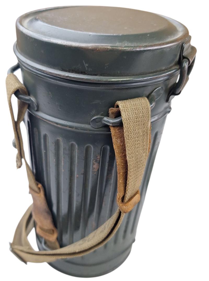 a small m38 gasmask with original carrying strap