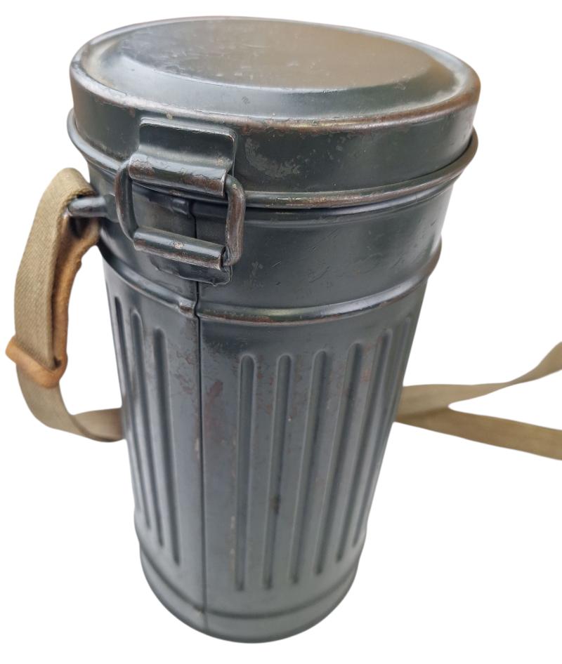 a small m38 gasmask with original carrying strap