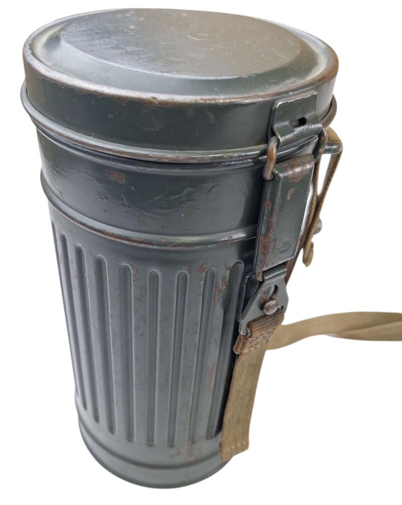 a small m38 gasmask with original carrying strap