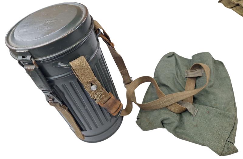 a small m38 gasmask with original carrying strap
